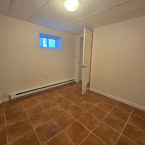 a view of an empty room with windows