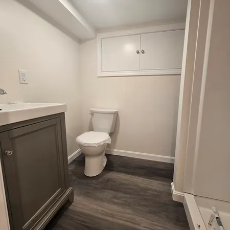 a bathroom with a toilet and a sink