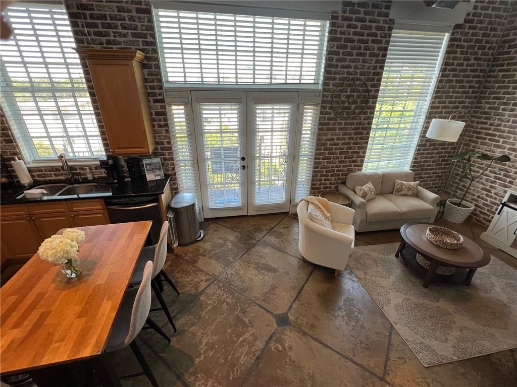 5434 Peachtree Road, Unit 119 Atlanta, GA 30341 - Photo 9 of 44 a living room with furniture and a large window