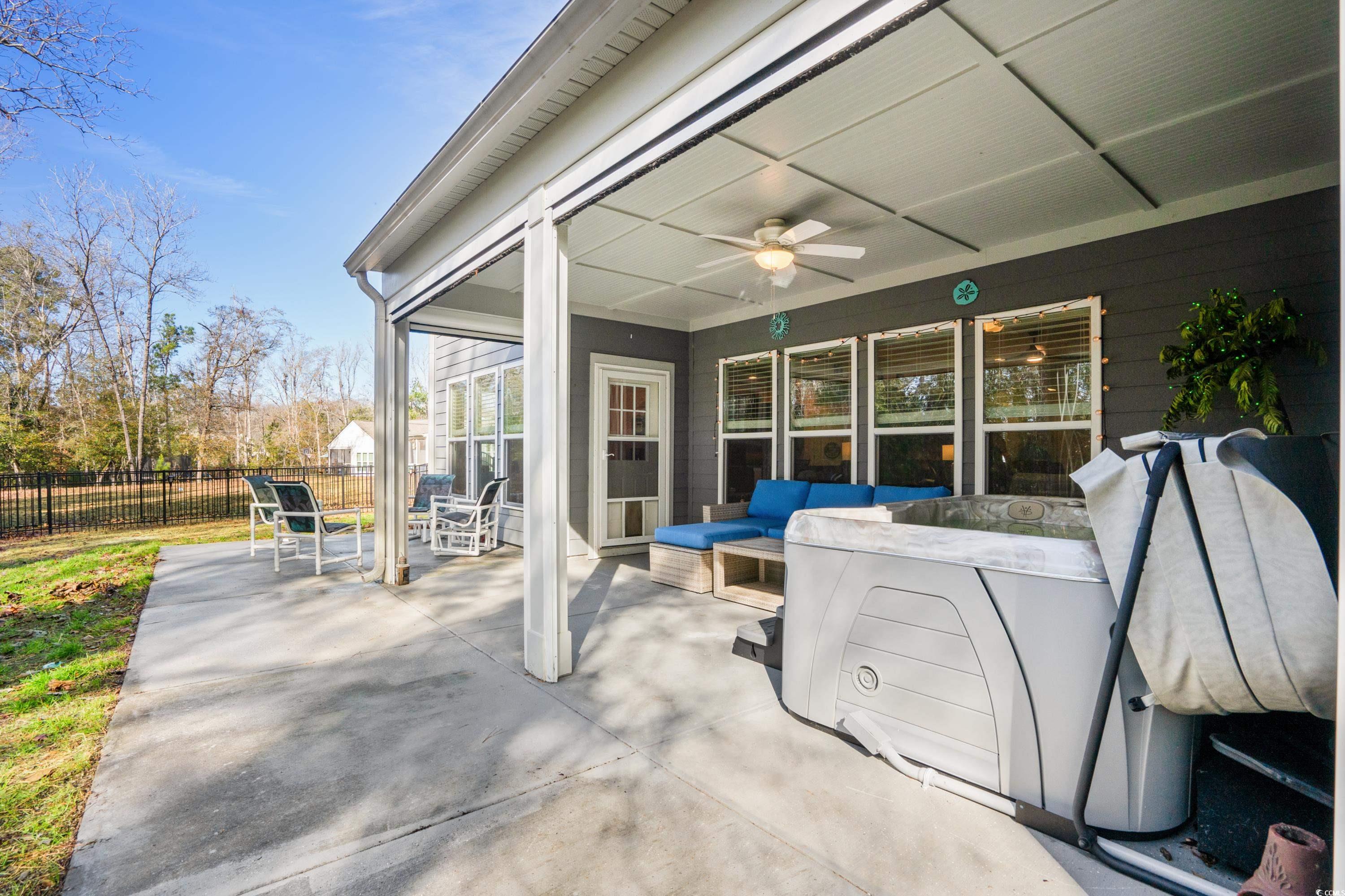 468 Trestle Way Conway, SC 29526 - Photo 25 of 36 patio with motorized screens open with ceiling fan