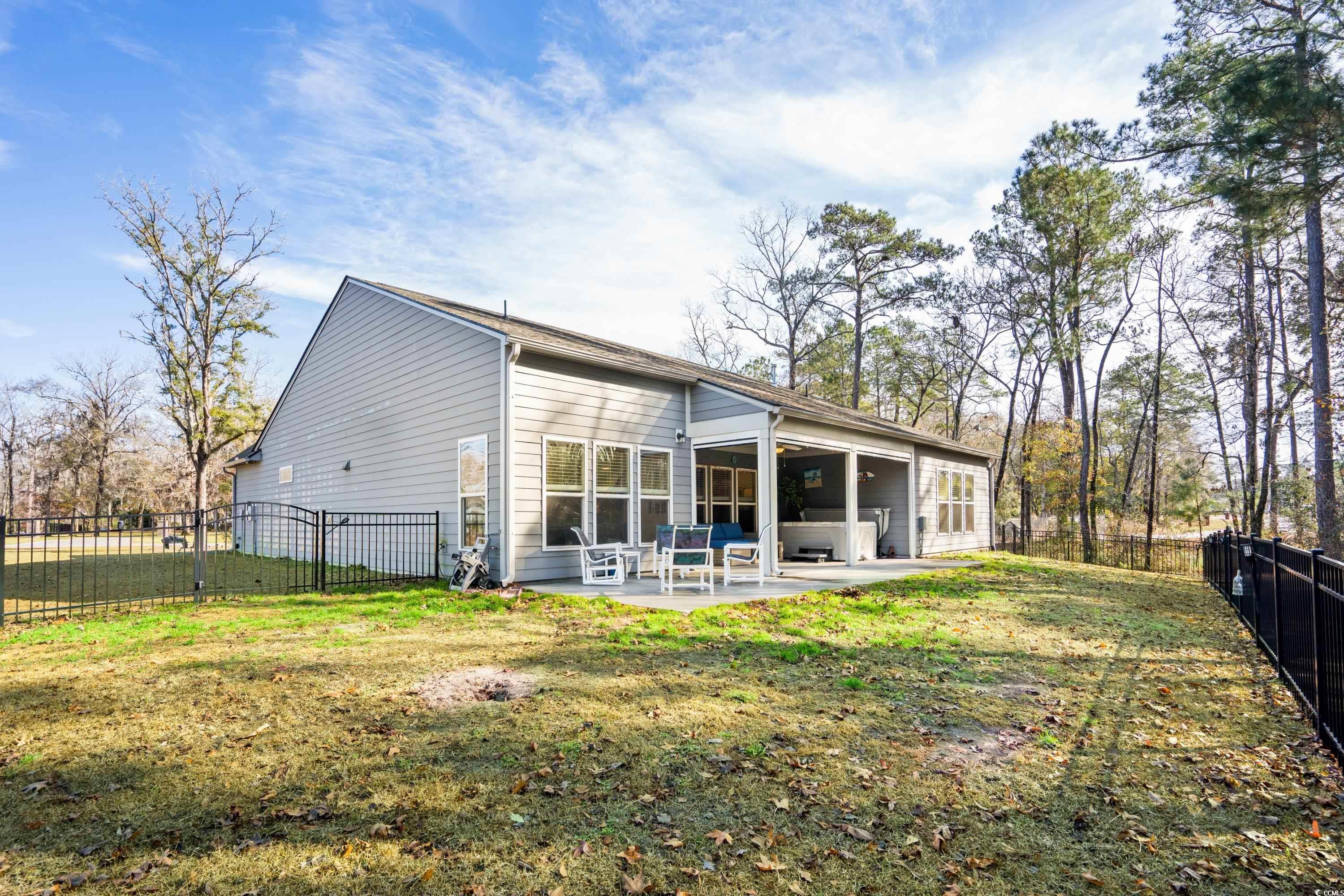 468 Trestle Way Conway, SC 29526 - Photo 27 of 36 Rear view of patio with motorized patio screens cl