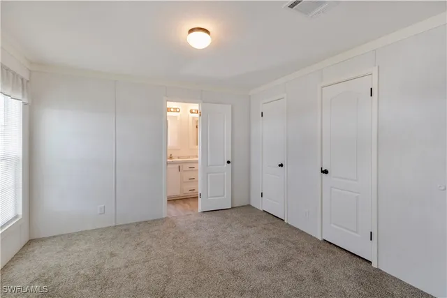 a view of an empty room and window