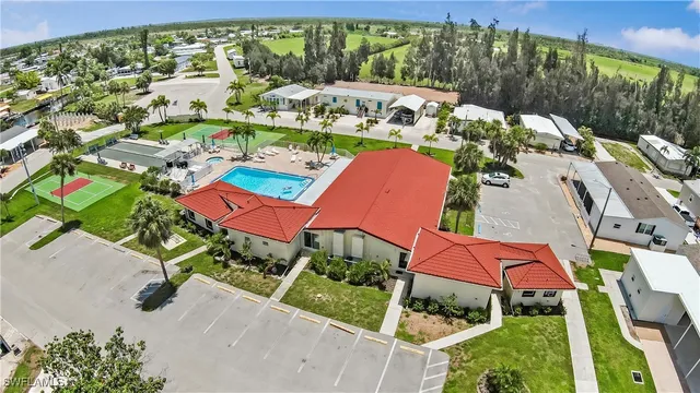 an aerial view of multiple houses with yard