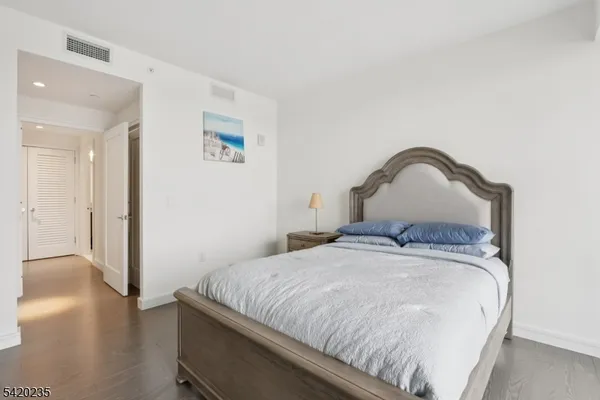 a bedroom with a bed and a closet