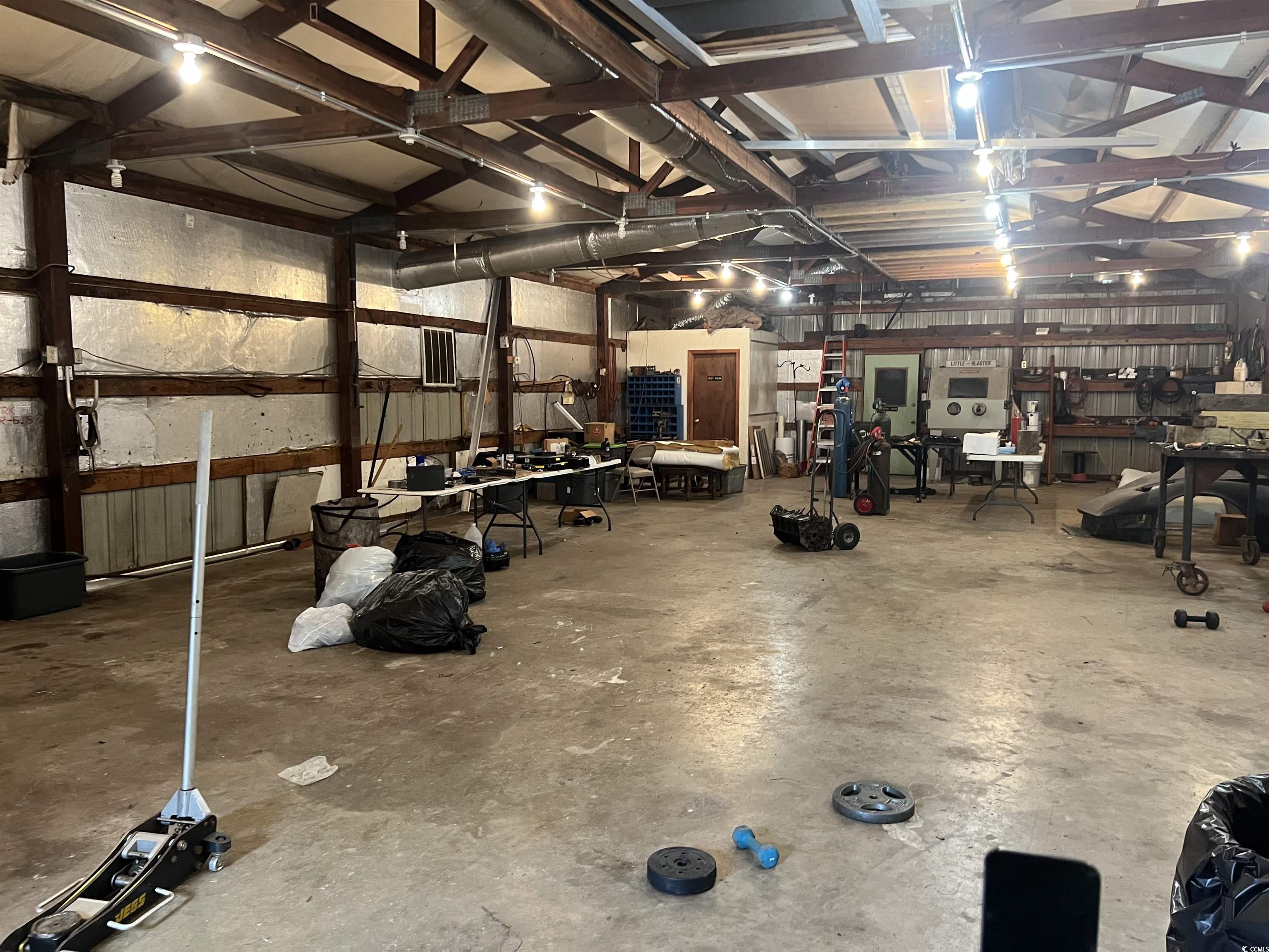 127 County Rd S-22-577 Georgetown, SC 29440 - Photo 11 of 11 Garage featuring a workshop area