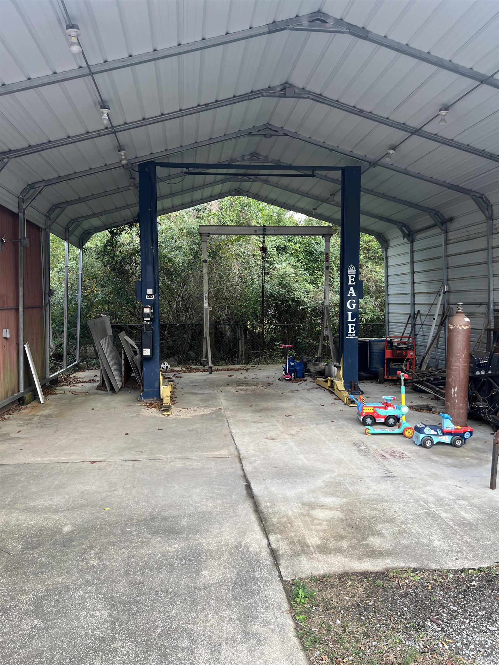 127 County Rd S-22-577 Georgetown, SC 29440 - Photo 9 of 11 View of car parking with a carport