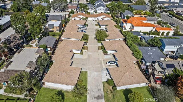 an aerial view of residential houses with outdoor space