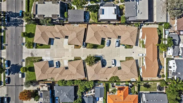 an aerial view of residential houses with outdoor space