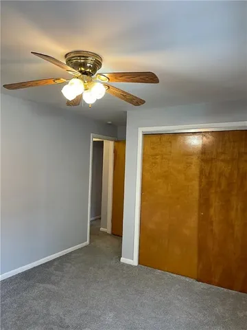 a bathroom with a sink toilet and mirror