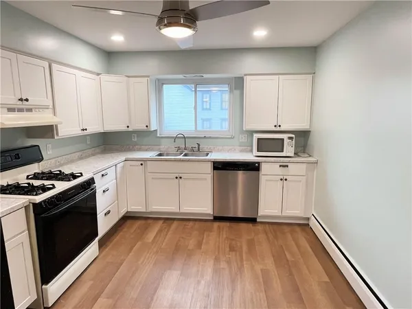 a kitchen with a stove and a refrigerator