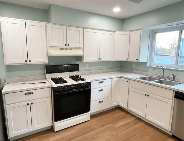 a view of room with window and a ceiling fan