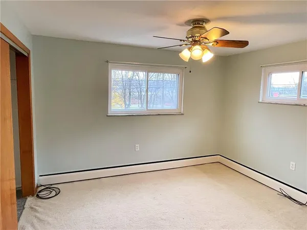 a bathroom with a sink a mirror a vanity and a shower