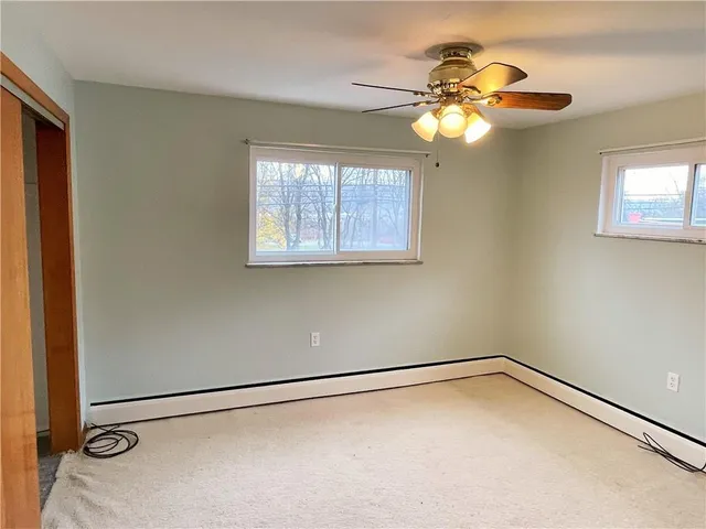 a bathroom with a sink a mirror a vanity and a shower