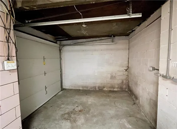 a bathroom with a sink toilet and a mirror