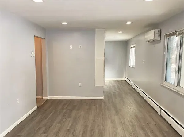 a kitchen with granite countertop a refrigerator and a stove top oven
