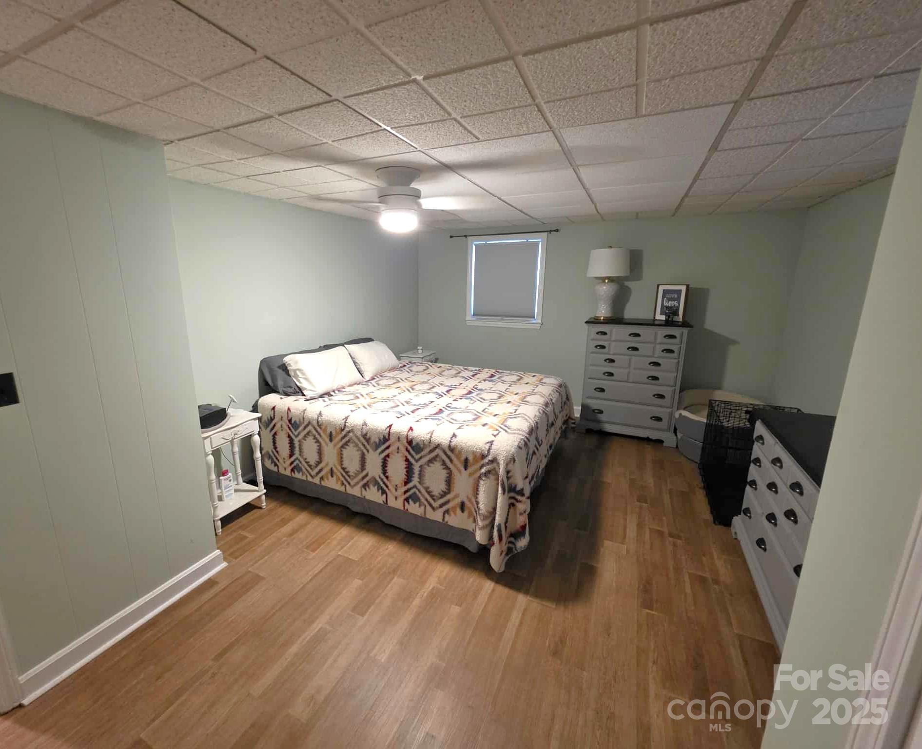 361 Reynolds Road, Unit 7 Lexington, NC 27292 - Photo 13 of 18 a bedroom with a bed and a wooden floor