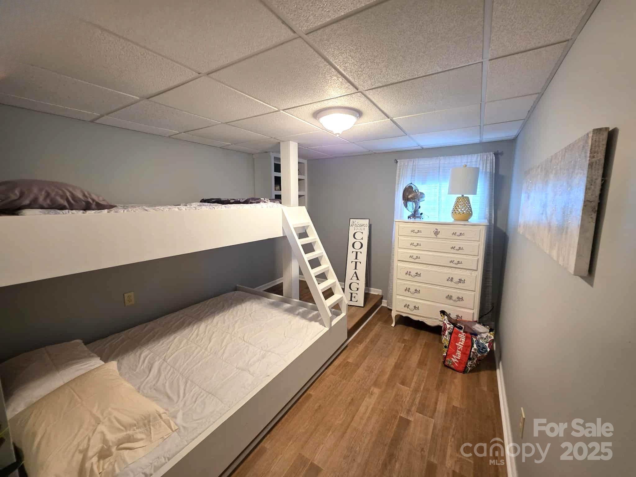 361 Reynolds Road, Unit 7 Lexington, NC 27292 - Photo 14 of 18 a bedroom with a bed and a cabinets