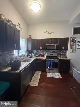 a bathroom with a sink vanity and a mirror