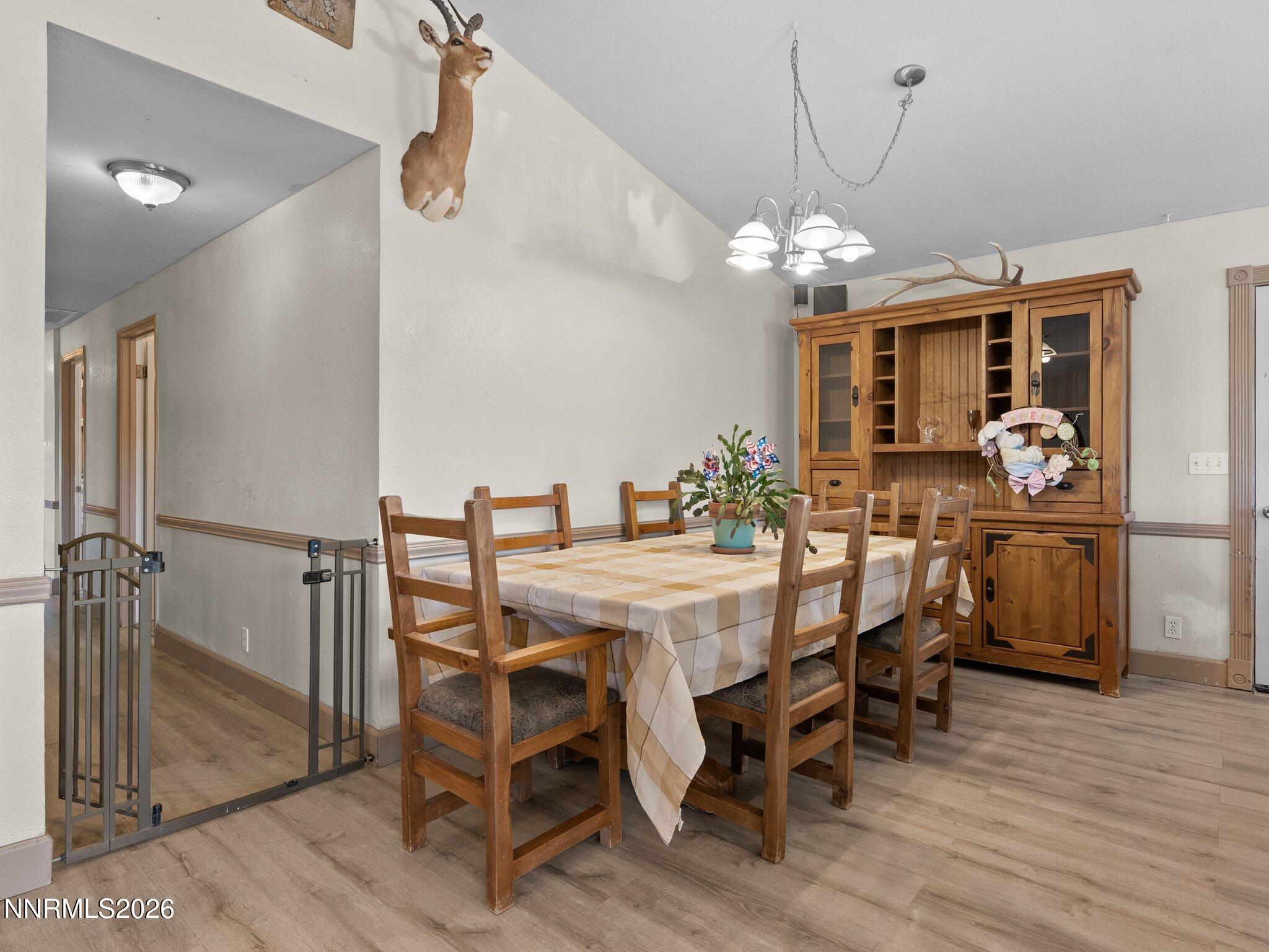 5500 Peak Road Reno, NV 89510 - Photo 15 of 56 a view of a dining room with furniture and wooden floor