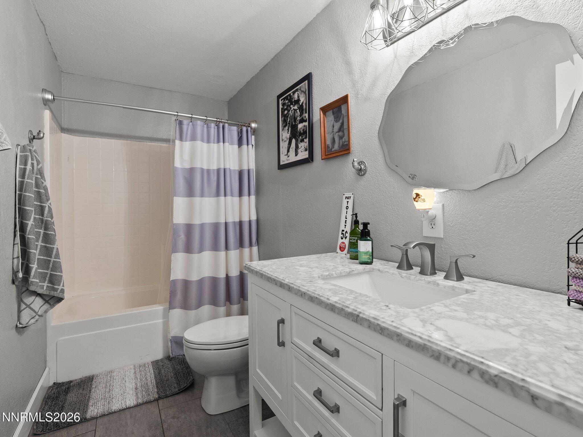 5500 Peak Road Reno, NV 89510 - Photo 30 of 56 a bathroom with a granite countertop sink toilet and shower
