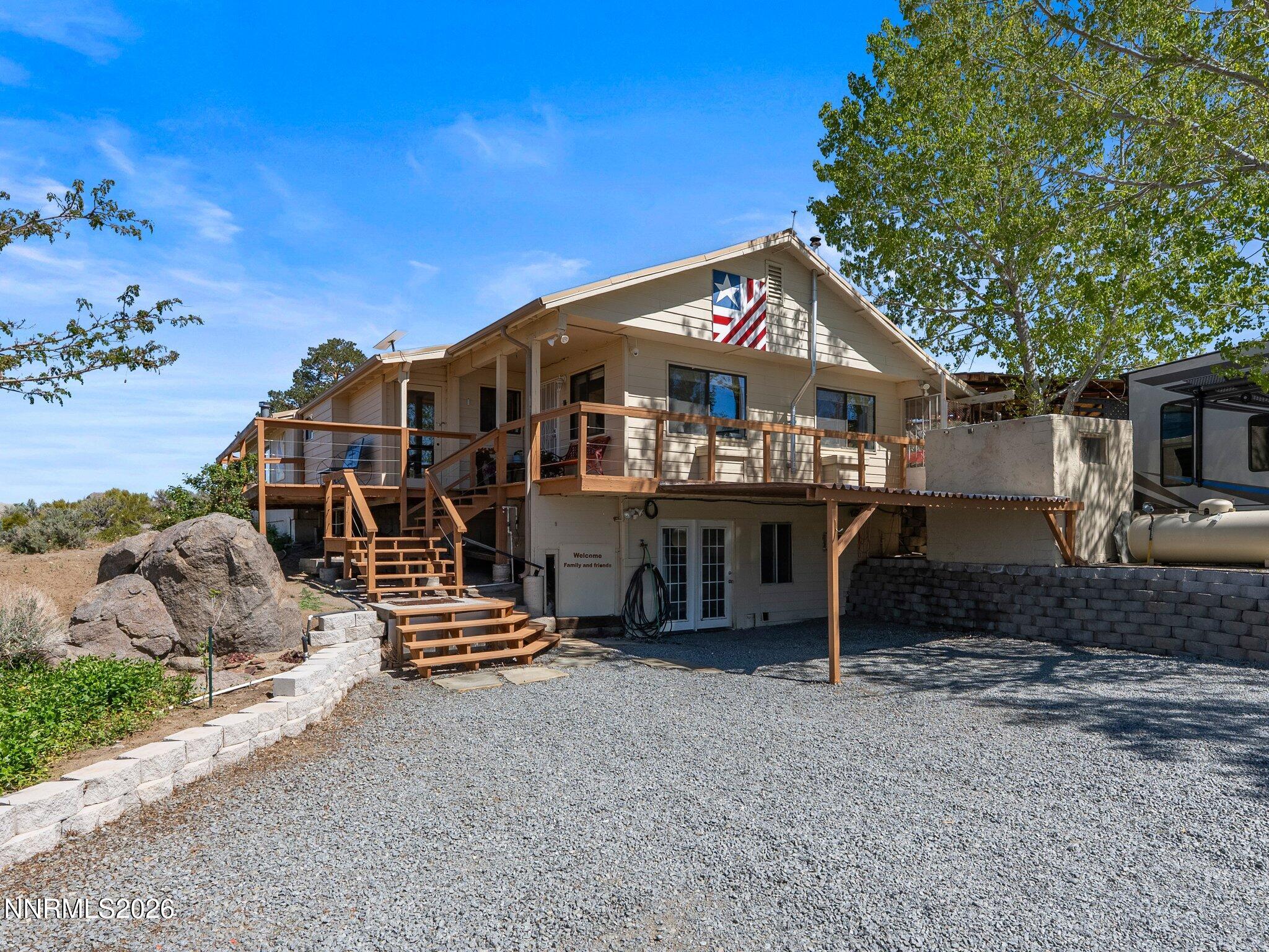 5500 Peak Road Reno, NV 89510 - Photo 4 of 56 a front view of a house with a yard