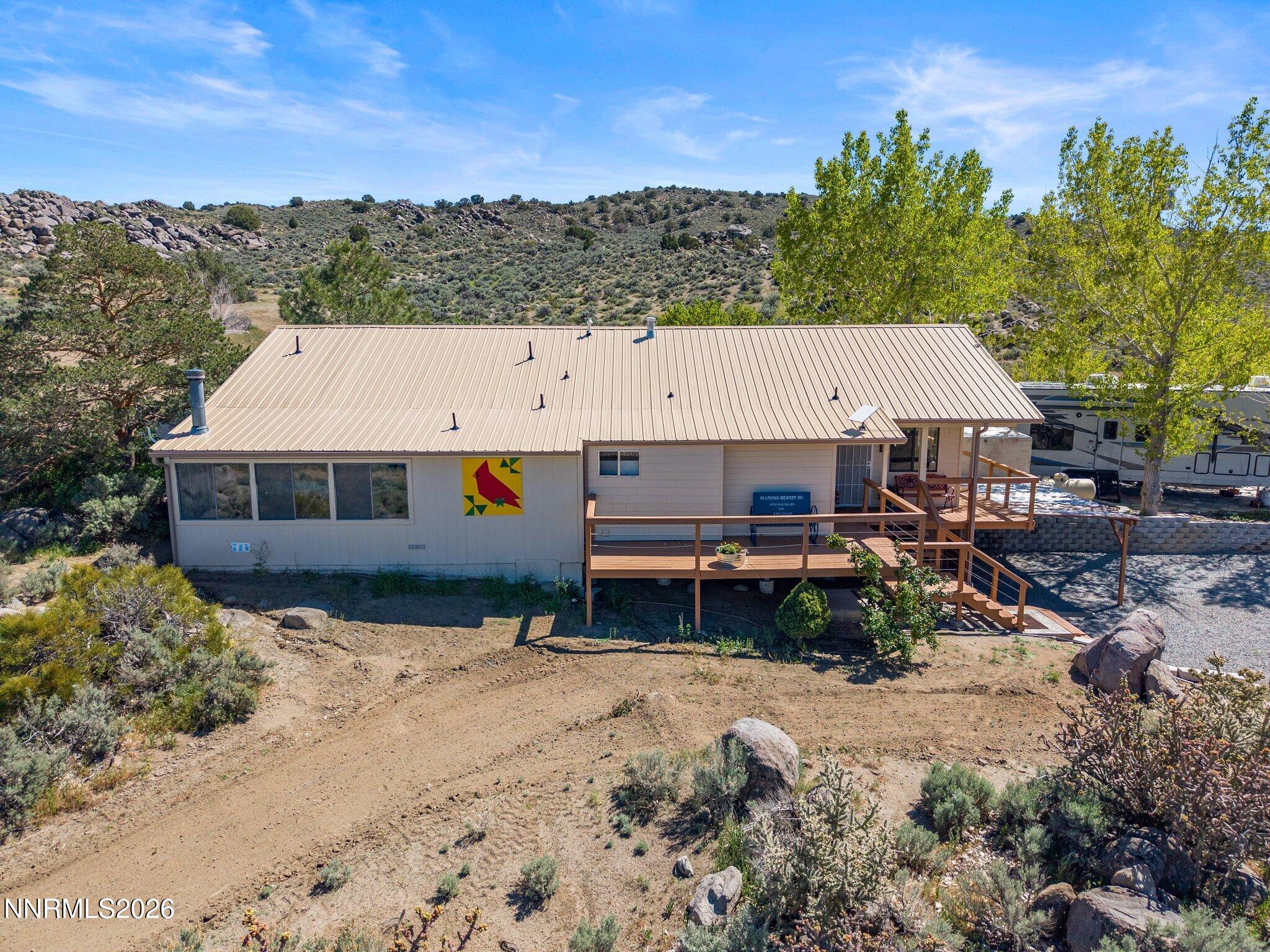 5500 Peak Road Reno, NV 89510 - Photo 51 of 56 a aerial view of a house with a yard and a large tree