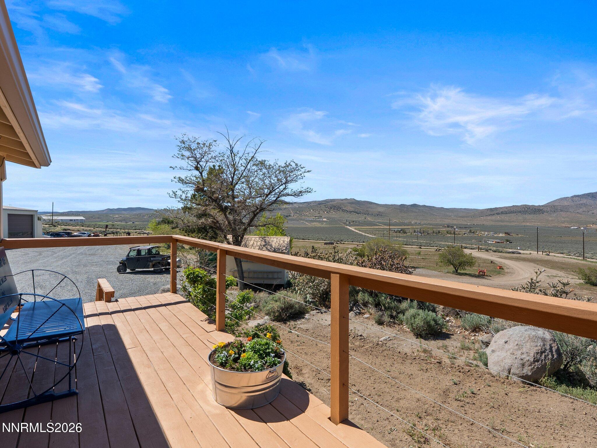 5500 Peak Road Reno, NV 89510 - Photo 7 of 56 a view of a balcony with lake view and wooden floor