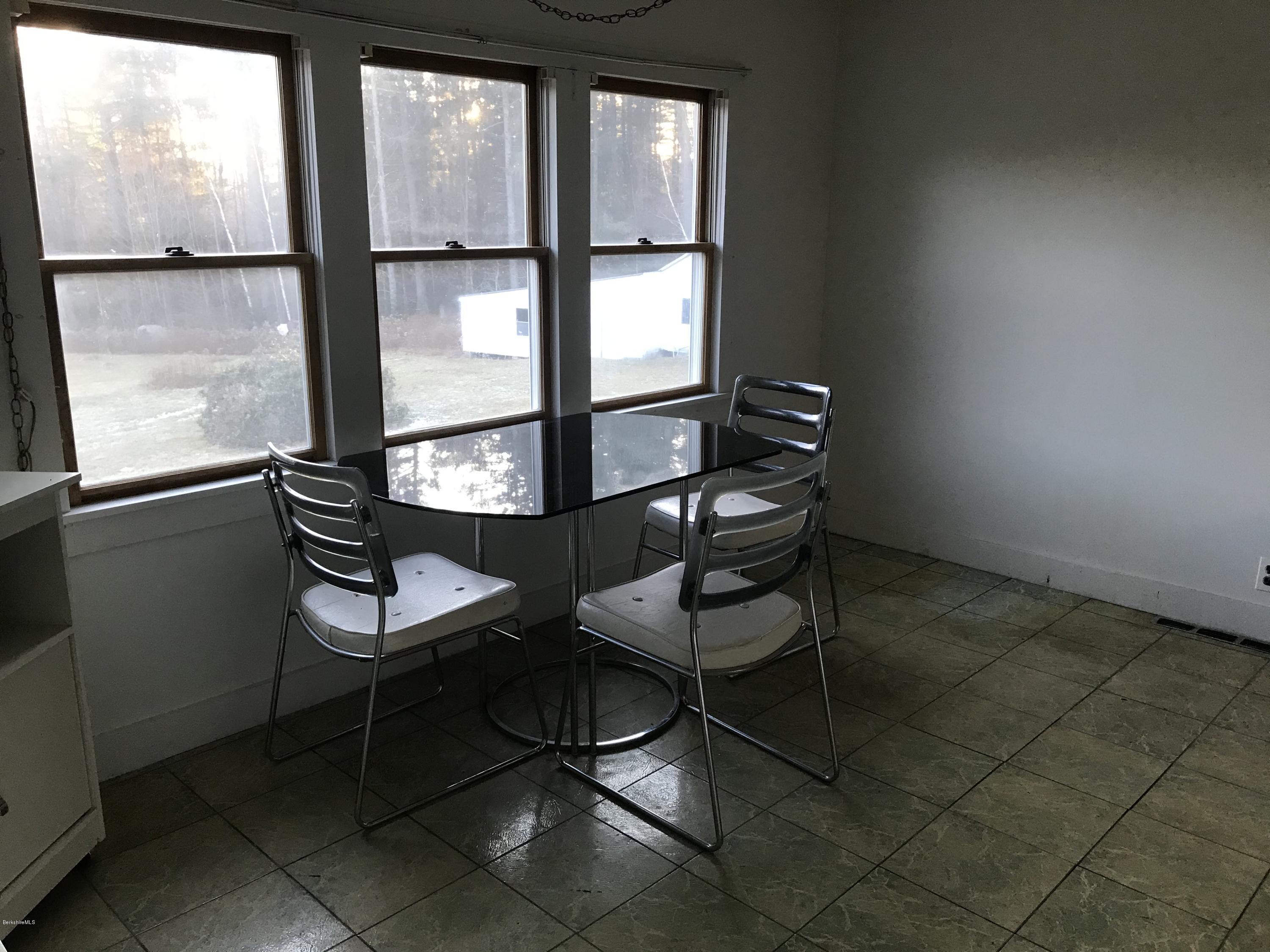 274 South County Road Florida, MA 01343 - Photo 4 of 16 a room with chairs