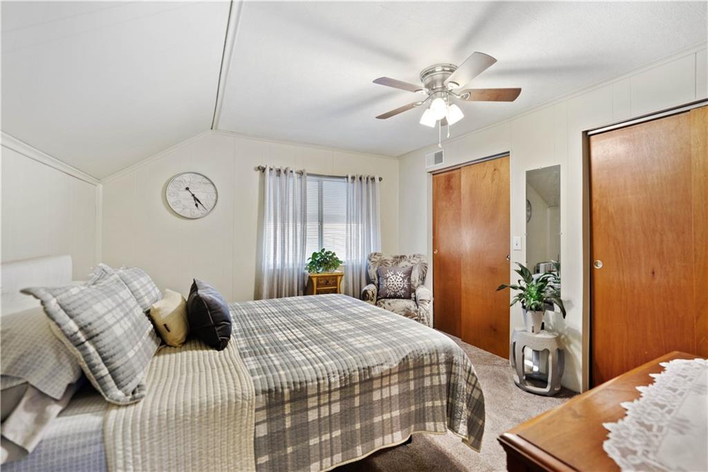 504 Oak Street Richeyville, PA 15358 - Photo 11 of 19 a bedroom with a bed and a chandelier