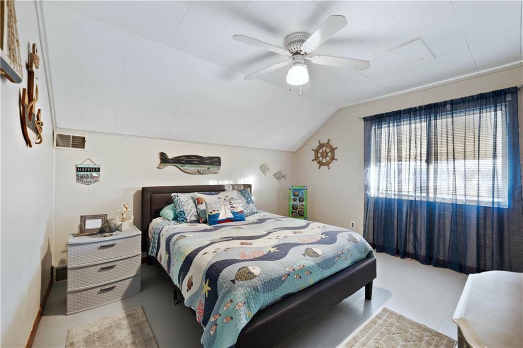 504 Oak Street Richeyville, PA 15358 - Photo 12 of 19 a bedroom with a bed and a chandelier