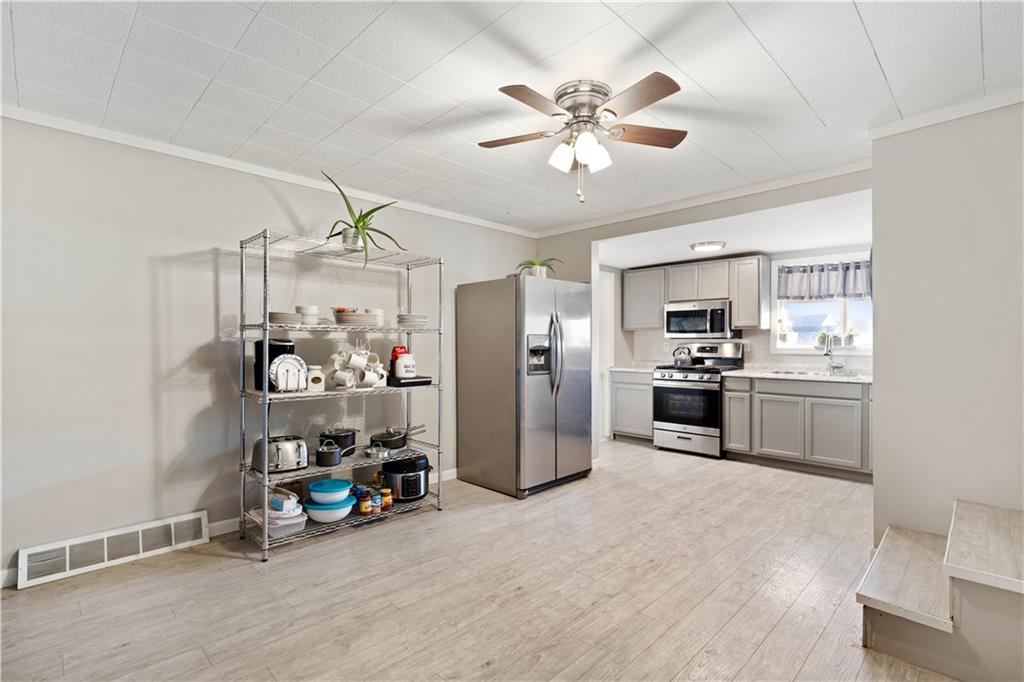 504 Oak Street Richeyville, PA 15358 - Photo 5 of 19 a view of a kitchen and refrigerator in a room