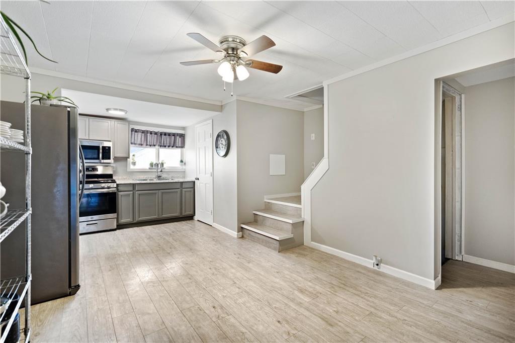 504 Oak Street Richeyville, PA 15358 - Photo 6 of 19 a view of kitchen with sink microwave and refrigerator