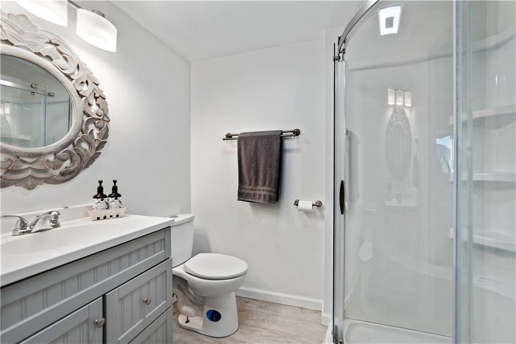 504 Oak Street Richeyville, PA 15358 - Photo 10 of 19 a bathroom with a toilet sink a mirror and vanity