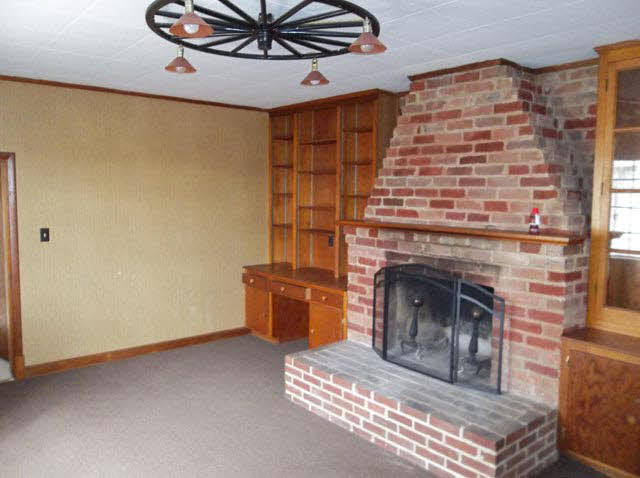 1435 Hewitt Road Swoope, VA 24479 - Photo 8 of 15 a living room with furniture and a fireplace