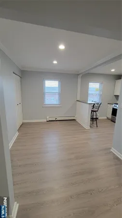 an empty room with furniture and view of room