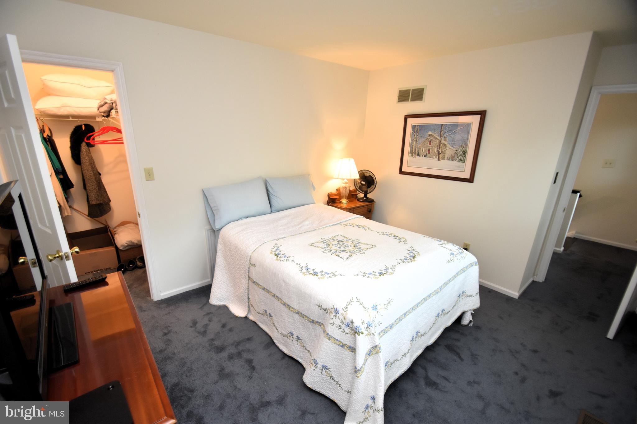 118 Red Pine Circle Newark, DE 19711 - Photo 20 of 32 a bed sitting in a bedroom next to a window