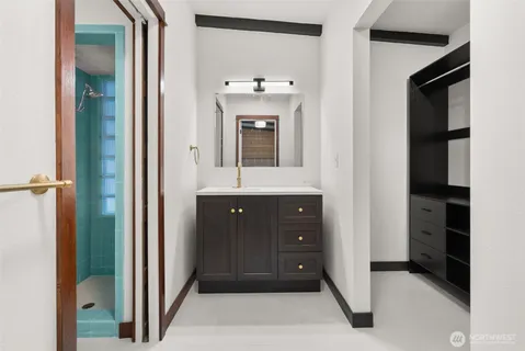 a bathroom with a sink and a mirror