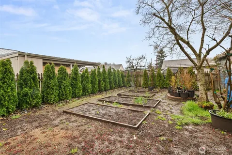 a view of a backyard with garden