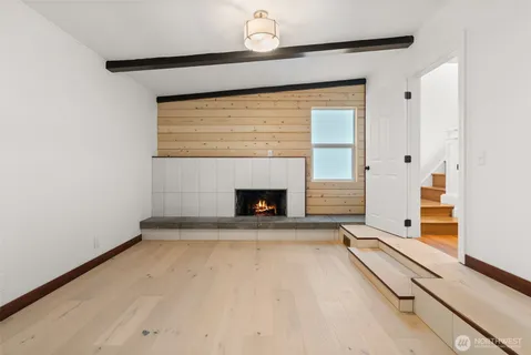 a view of empty room with fireplace