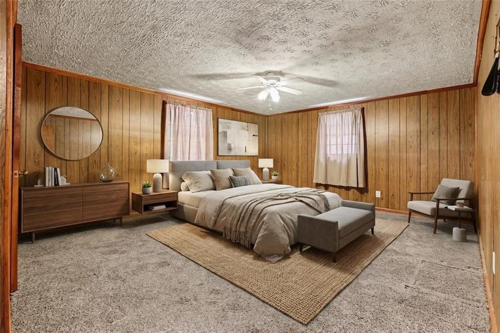 7019 Lake View Lane Doraville, GA 30360 - Photo 19 of 32 a spacious bedroom with a bed and a chandelier