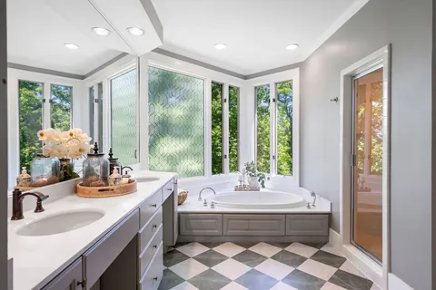 a bathroom with a toilet sink and a window