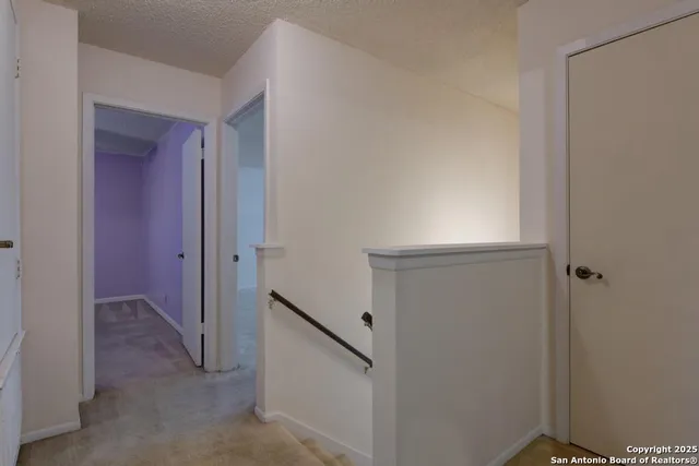 a view of a hallway with closet