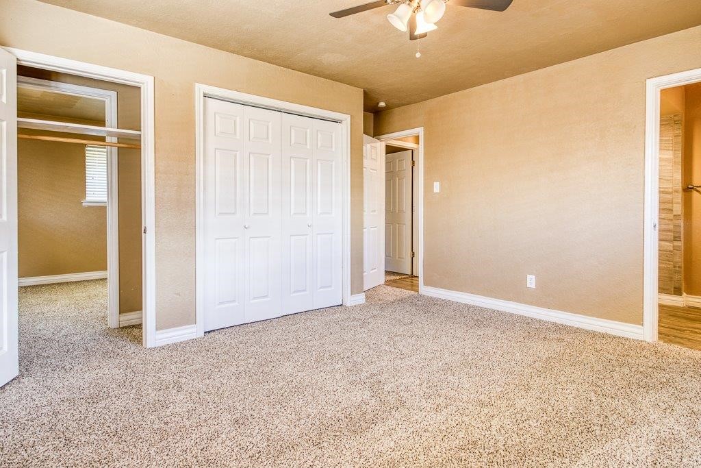 111 Chase Drive Portland, TX 78374 - Photo 18 of 26 an empty room with closet and a chandelier fan