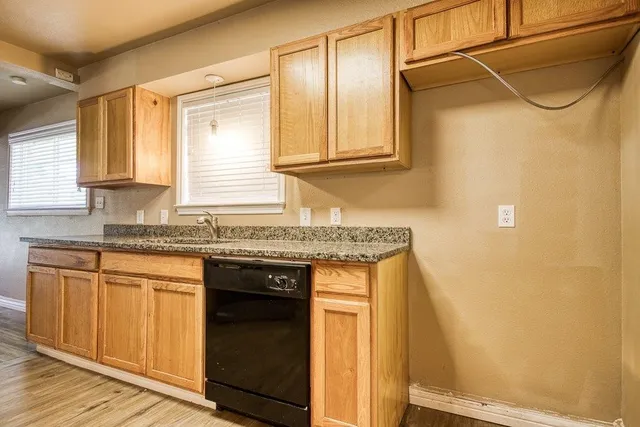 a kitchen with granite countertop white cabinets and a granite counter tops