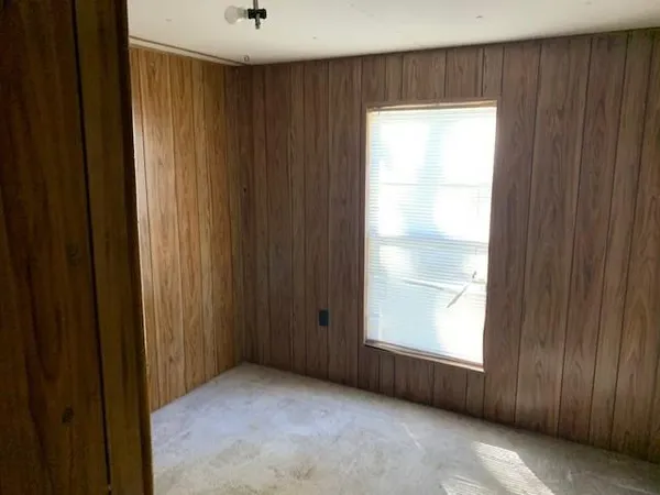 a bathroom with a sink a toilet a mirror and shower