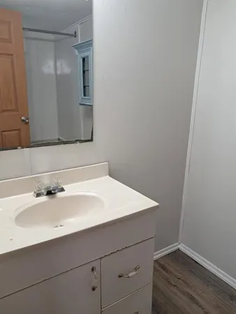 a view of a bathroom with a shower and a toilet