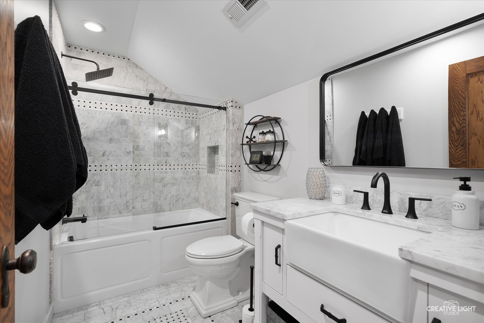 11626A Church Road Yorkville, IL 60560 - Photo 21 of 42 a bathroom with a sink a toilet and a shower