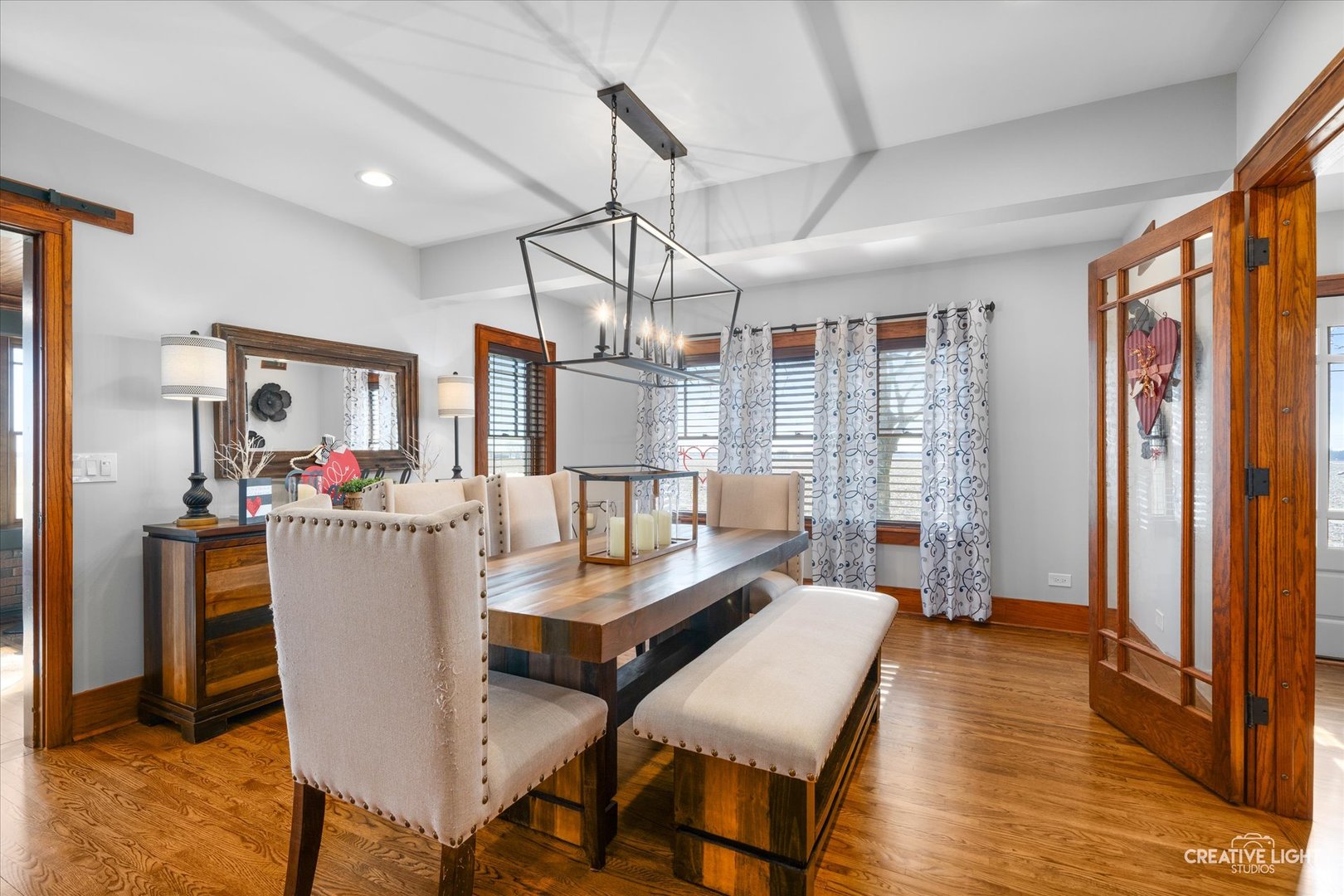 11626A Church Road Yorkville, IL 60560 - Photo 5 of 42 a dining room with furniture a chandelier and wooden floor
