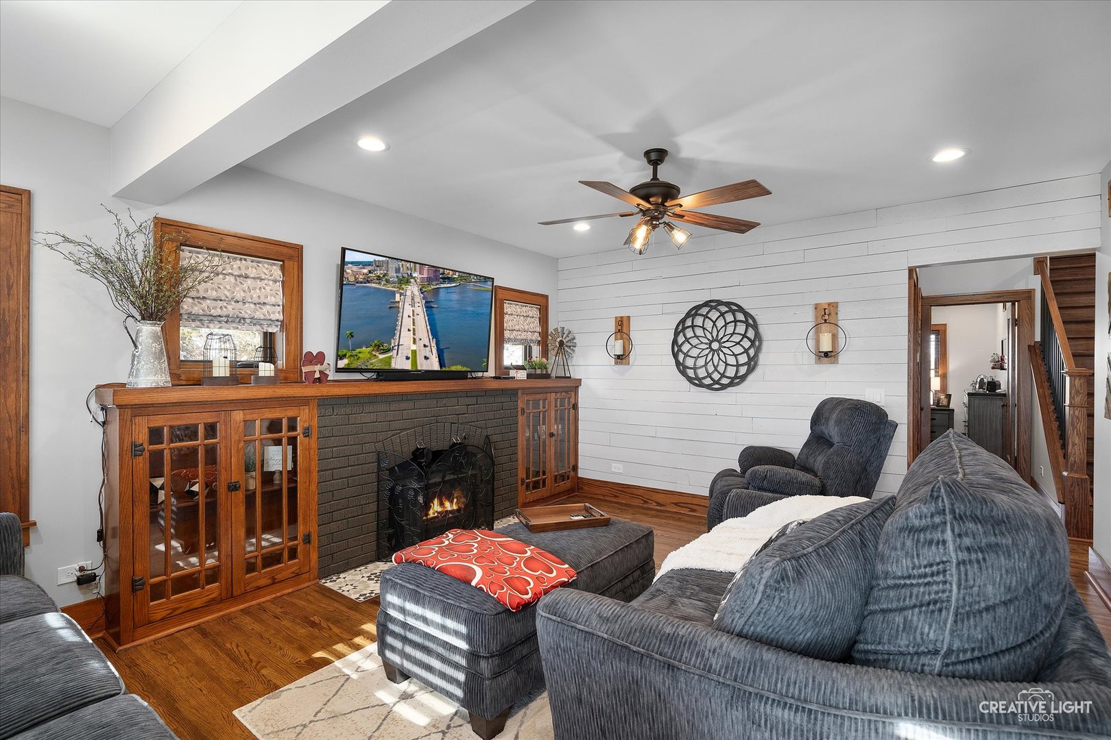 11626A Church Road Yorkville, IL 60560 - Photo 8 of 42 a living room with furniture a clock and a fireplace