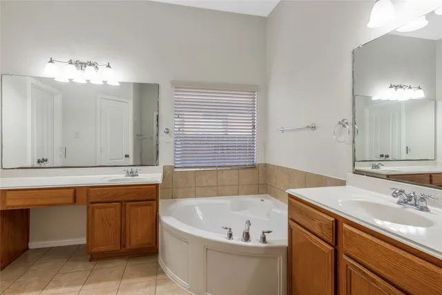 a bathroom with a bathtub and a sink